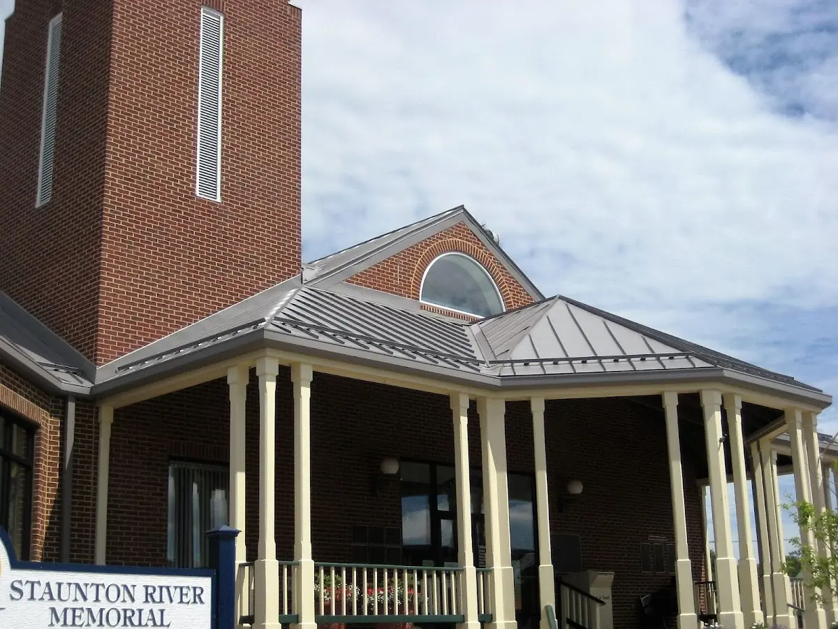 Skilled roofing craftsmen working on a residential roof in Gravesville